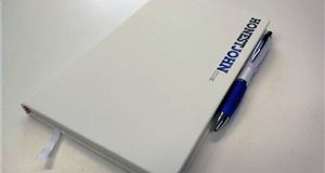 An HonestJohn.co.uk notepad and pen